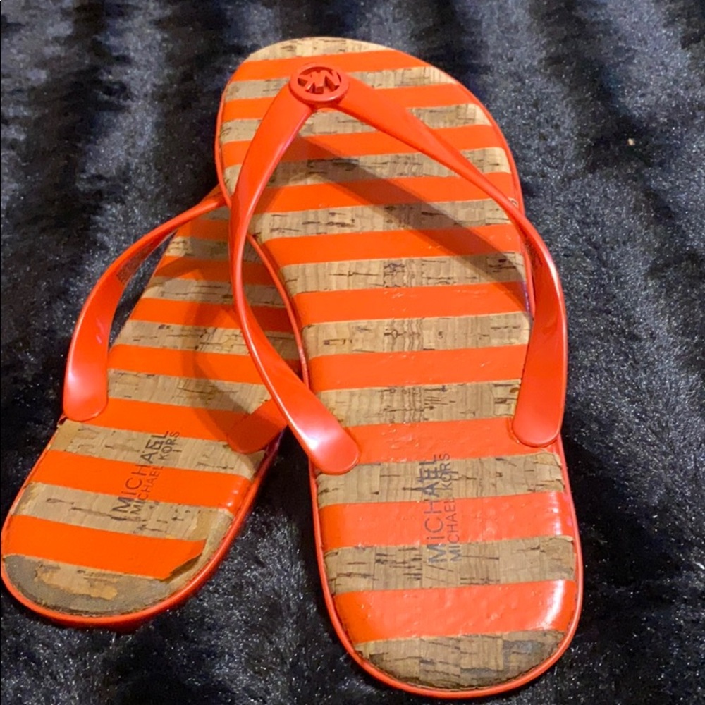 Used size 11 red Michael Kors sippers.